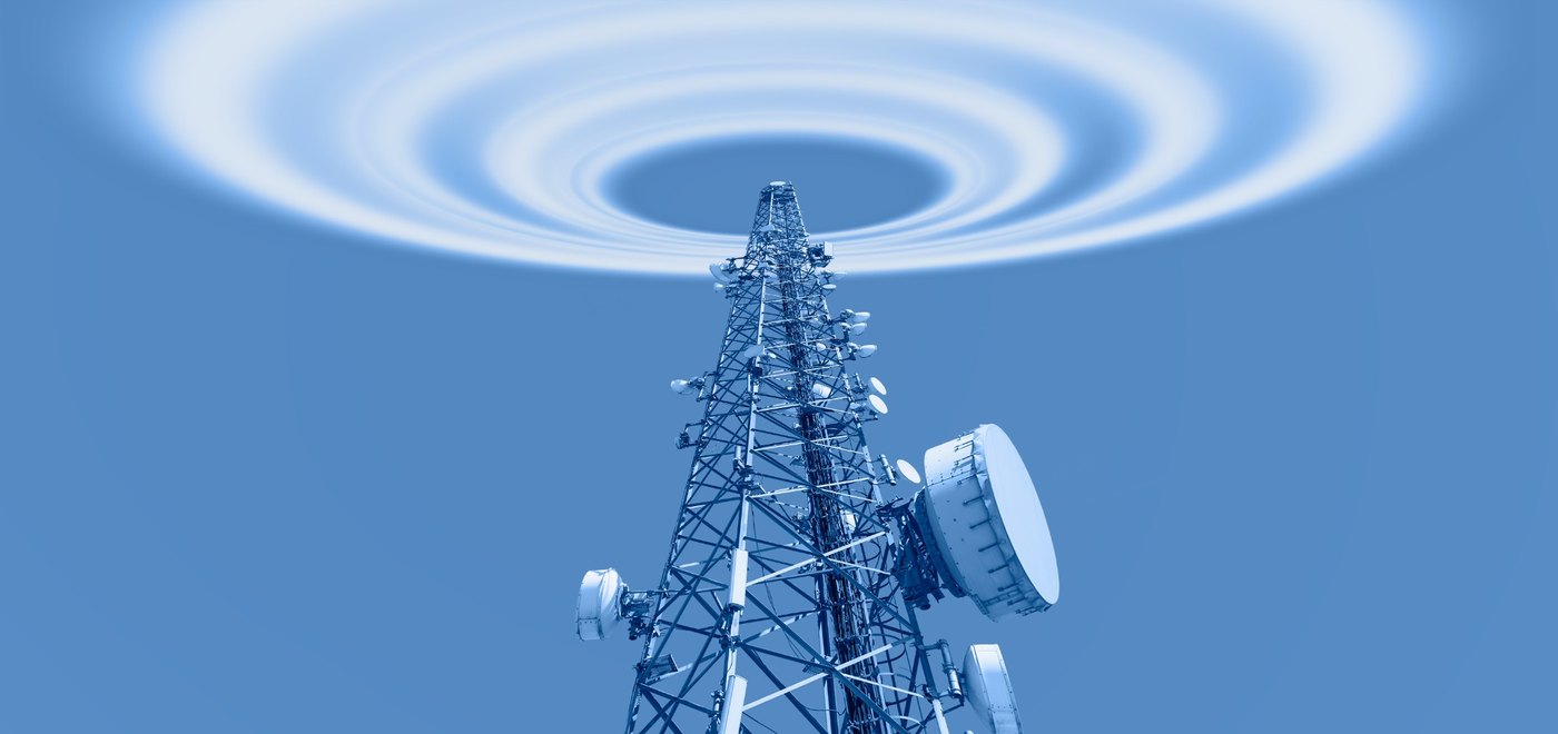 Communications tower with radiating waves